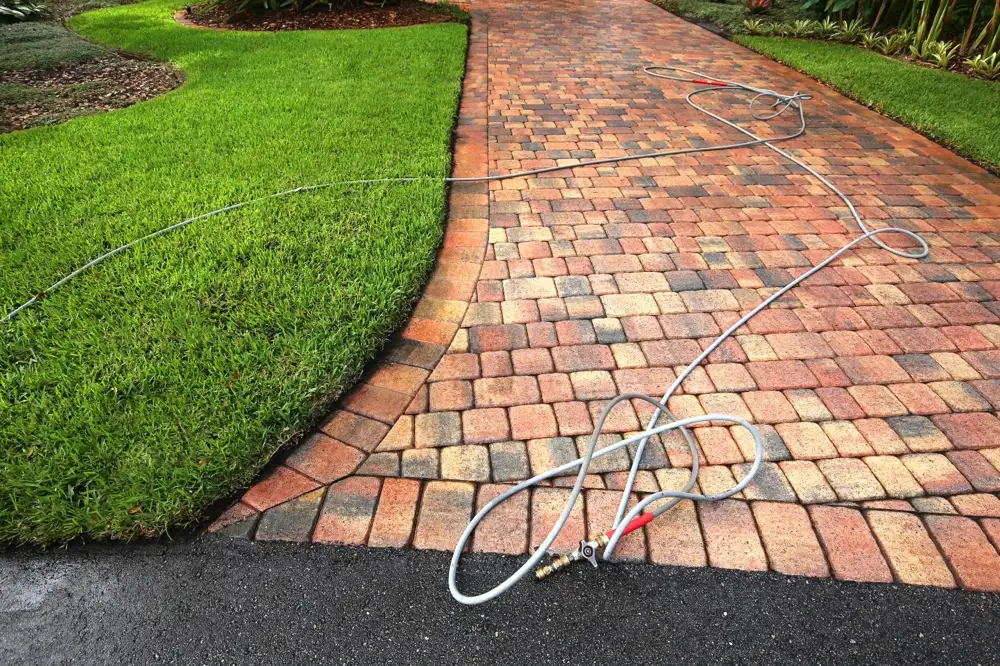 Shot of a power washer lying on a clean driveway